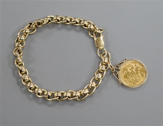 A 9ct gold bracelet hung with a mounted half sovereign.